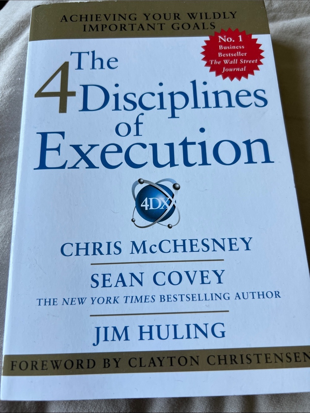 The 4 Disciplines of Execution by Chris McChesney | White & Gold Cover